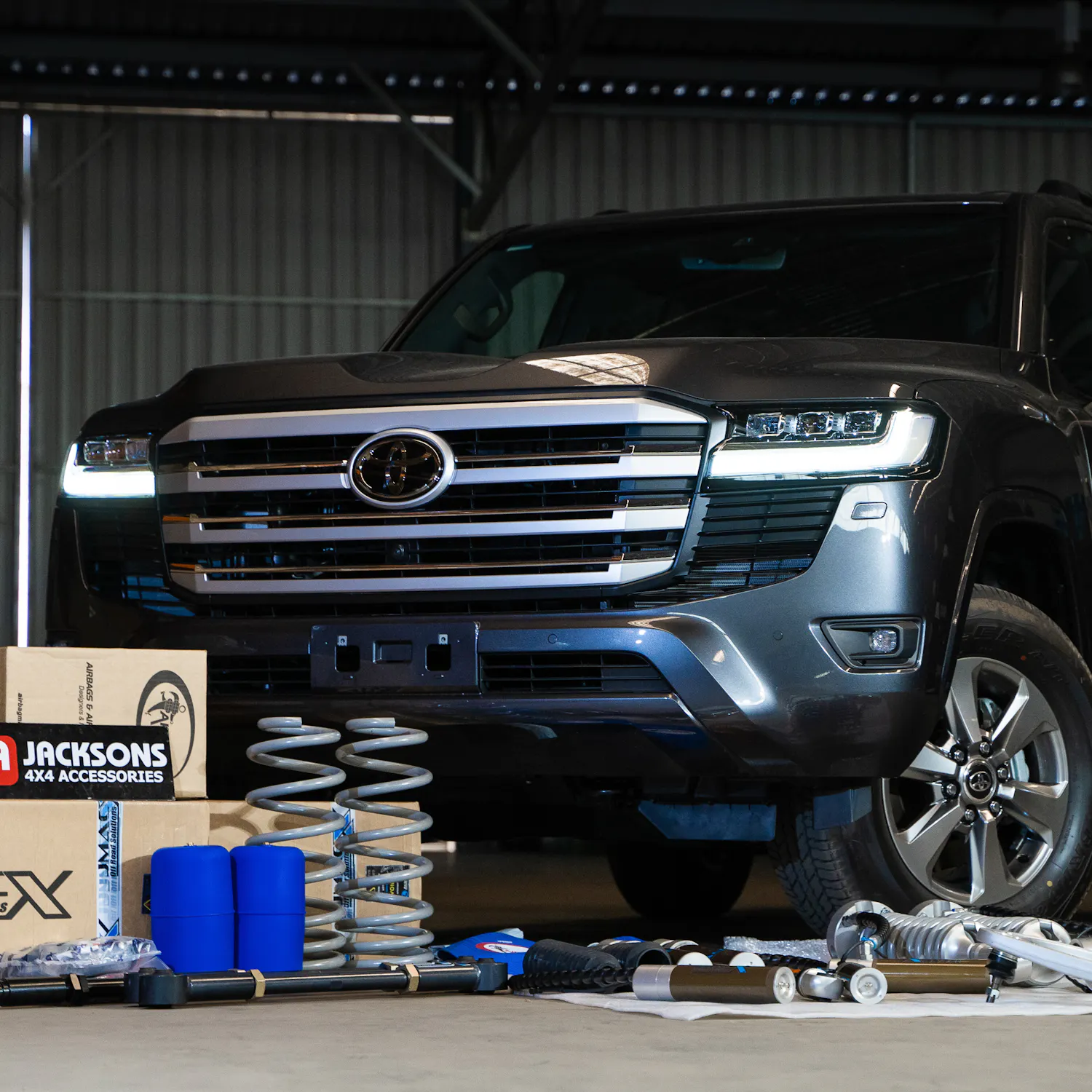 4x4 build surrounded by JMACX boxes and products