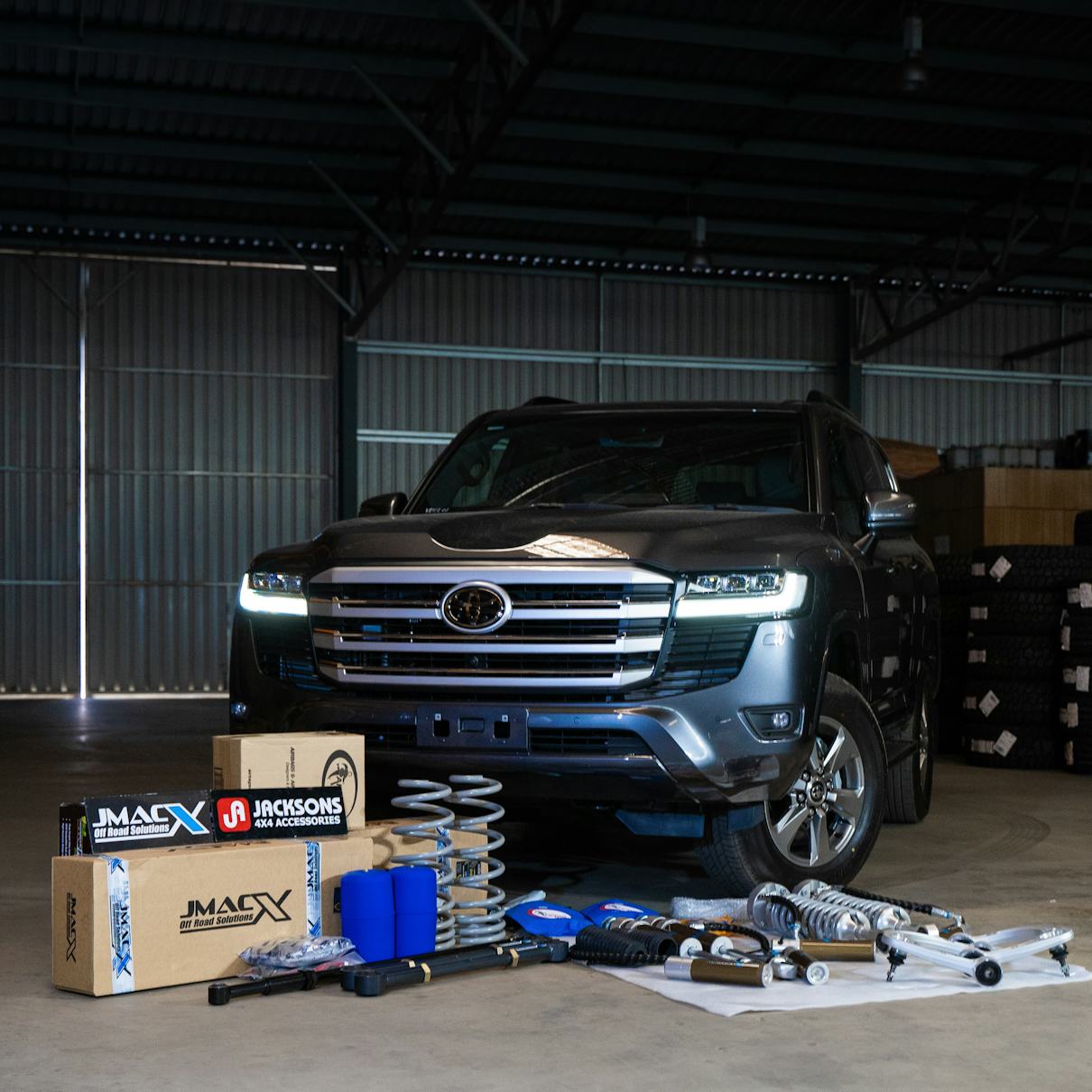 4x4 build surrounded by JMACX boxes and products