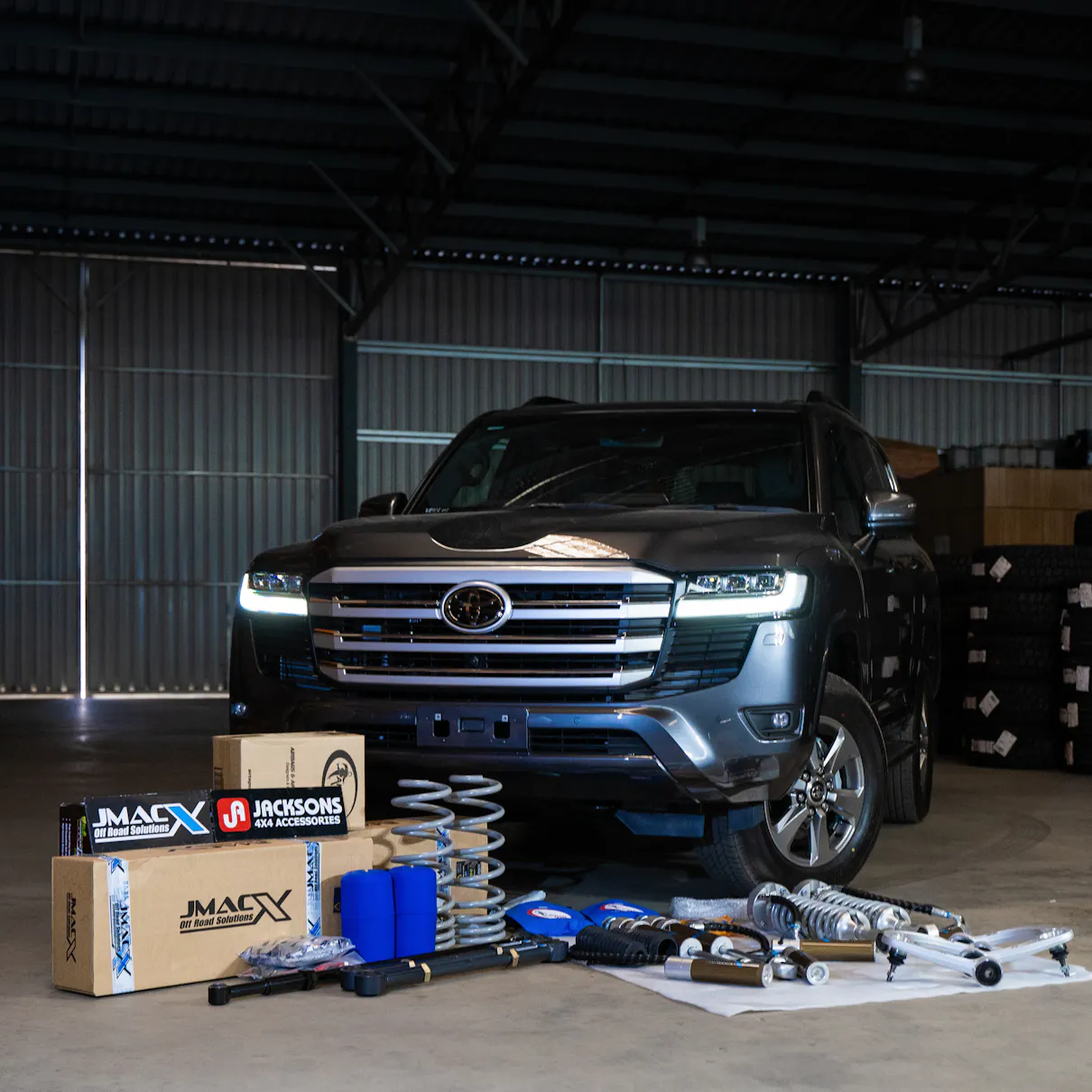 4x4 build surrounded by JMACX boxes and products