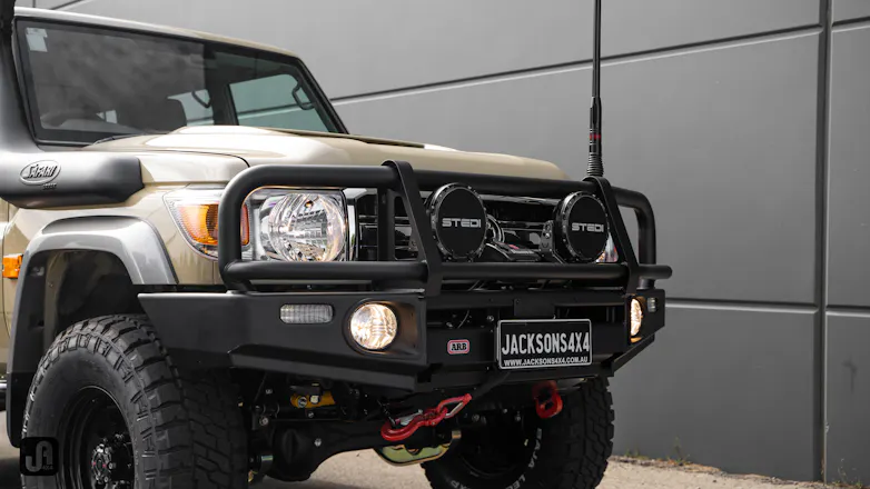 Front view of 79 Series Landcruiser in Sandy Taupe with Stedi Type-X Pro lights