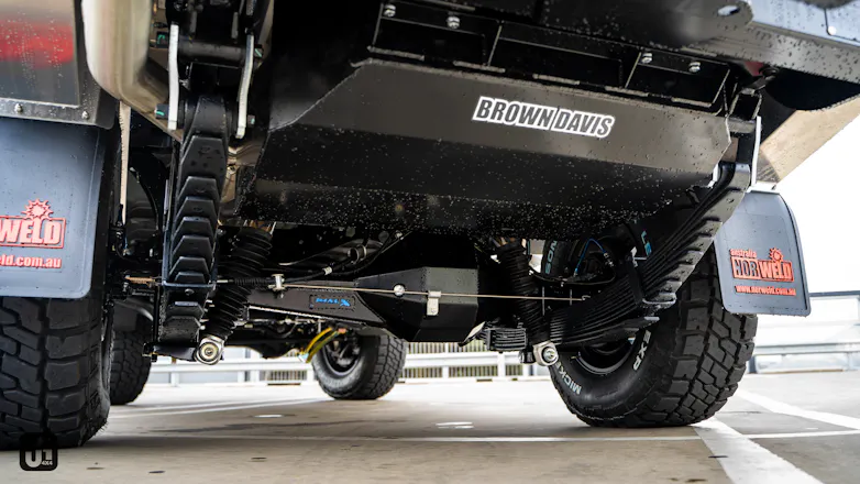 Underneath of 79 Series Dual Cab with mods including Brown Davis 185L tank