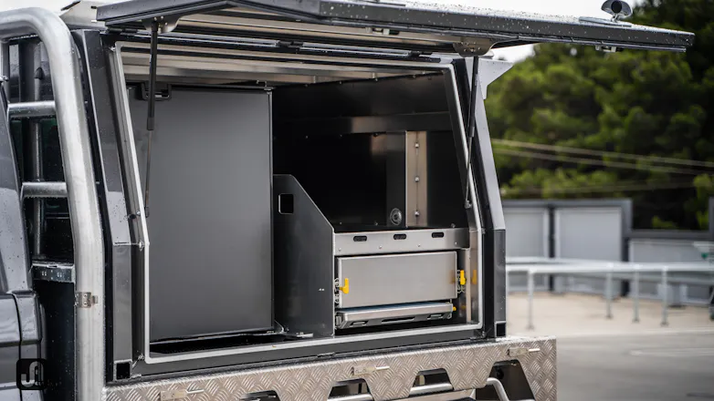 Opened Norweld Canopy of 79 Series showing Norweld tray and Bushman fridge