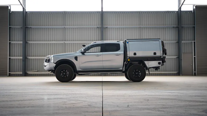 Silver Next-Gen 2023 Ford Ranger fully modified, including a canopy & tray