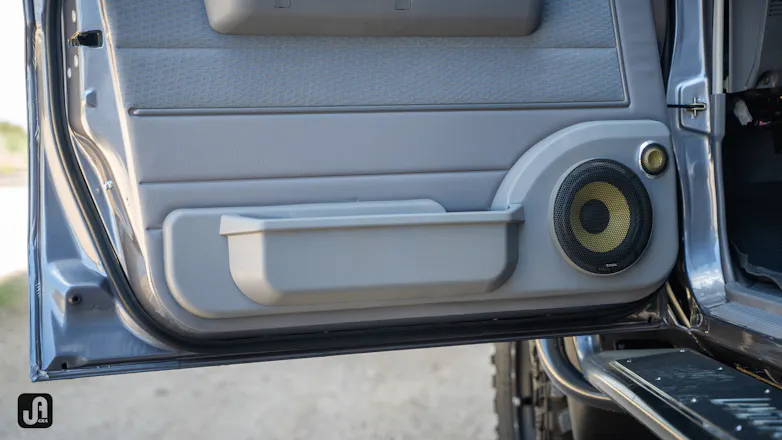 Inside of 79 Series Landcruiser door, with Focal 10” subwoofer