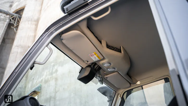 Interior roof of 79 Series with visors and overhead storage