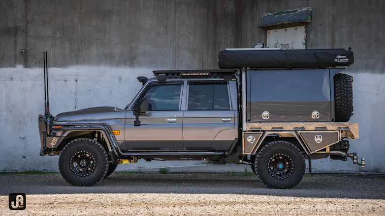 Graphite wrapped 79 Series with ATD Customs side steps & rails and Rhino Rack Pioneer platform