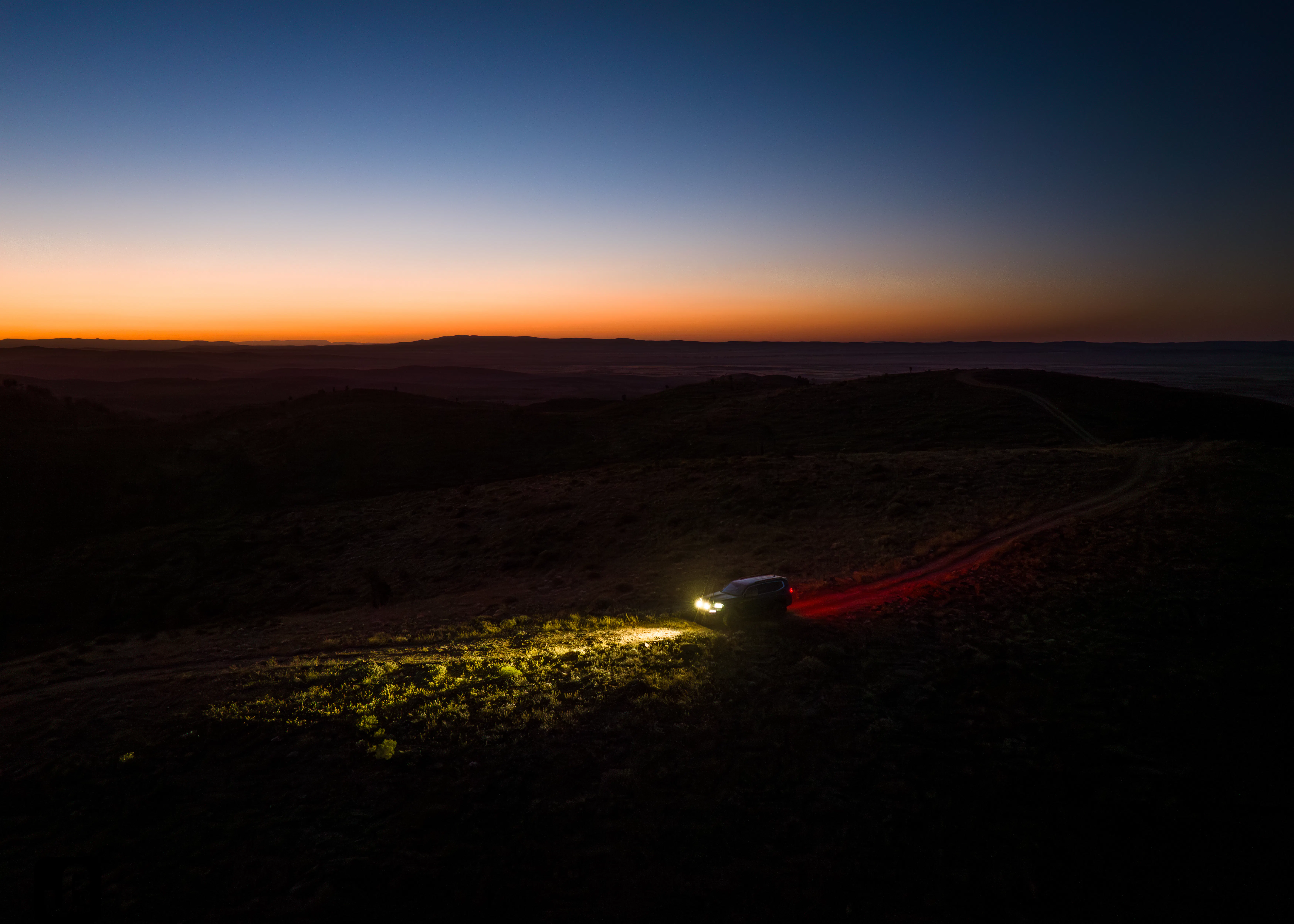 300 series Toyota Landcruiser at night on a 4WD track