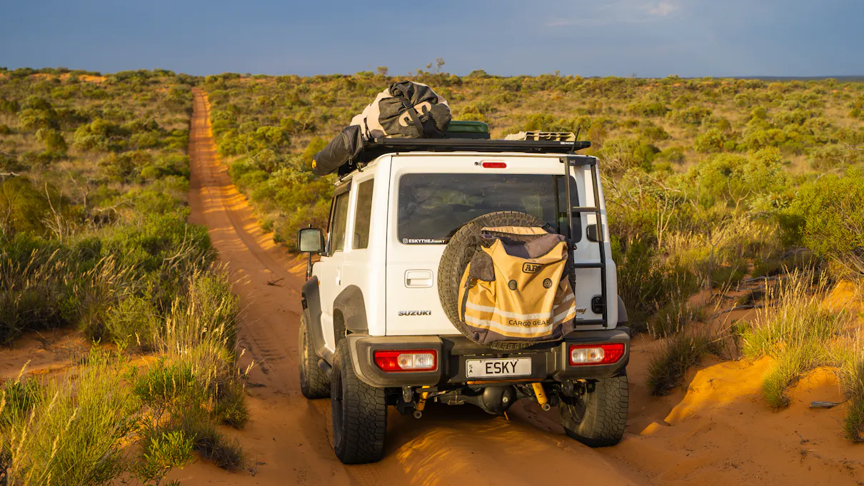 Suzuki Jimny on Googs Track in South Australia at sunset